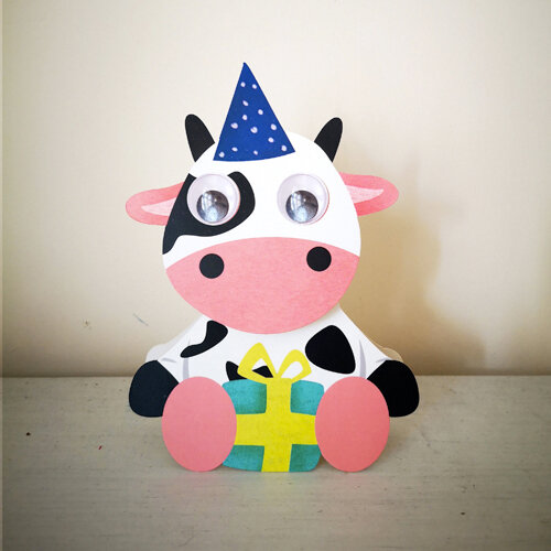 WHK022 wiebelhoofd wenskaart - koe met cadeautje